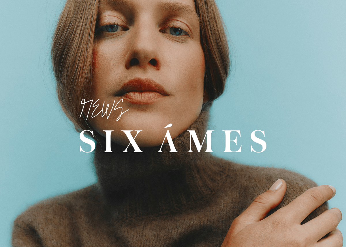 Six Ámes banner med modell i off shoulder strikkegenser og lyse bukser mot ensfarget bakgrunn